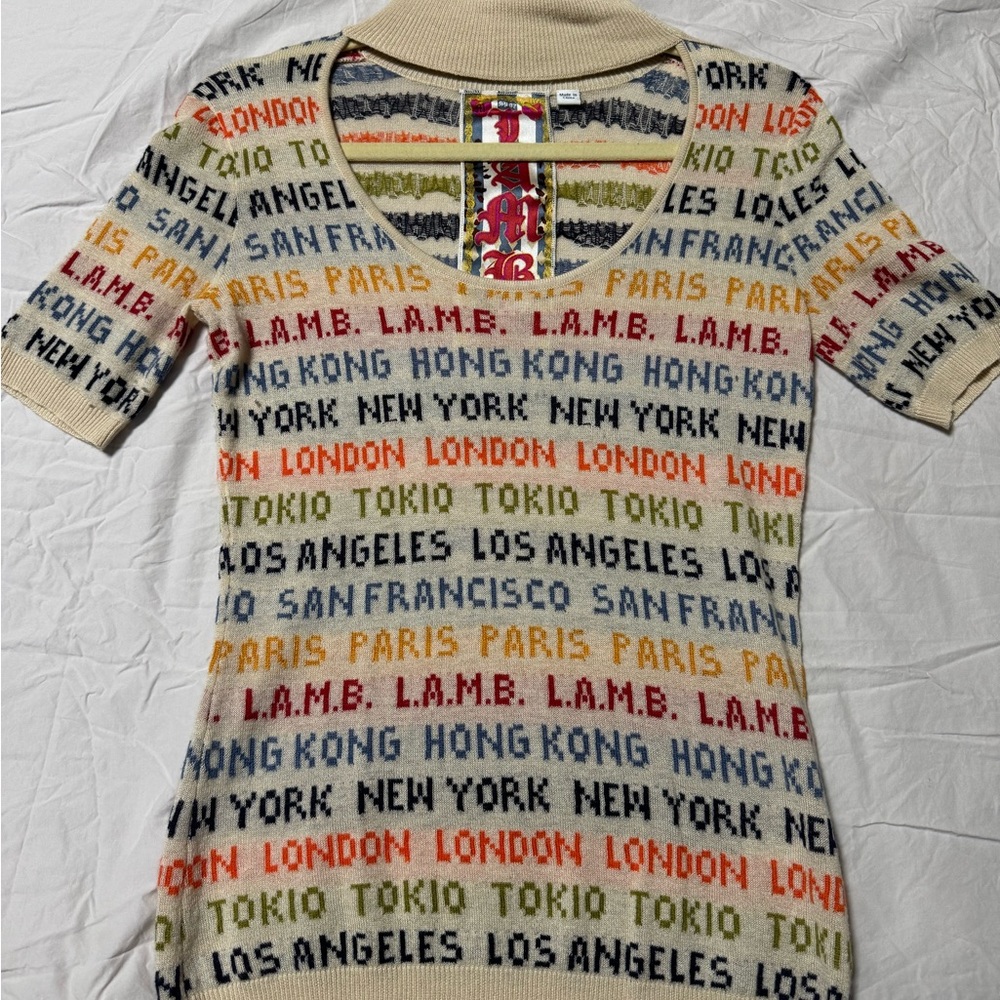 L.A.M.B sweater  zip up neck on the side